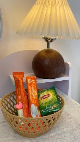 a basket filled with toothpaste and other items on a table at Zenith Haven - Boutique Stay in Phú Quốc