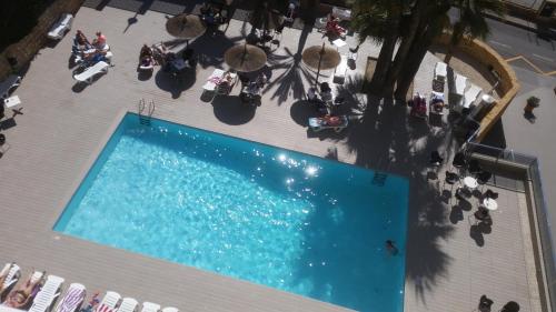 an overhead view of a swimming pool in a building at Mont-Park in Benidorm