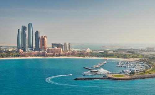 an aerial view of a harbor with boats in the water at Emirates Palace Mandarin Oriental, Abu Dhabi in Abu Dhabi