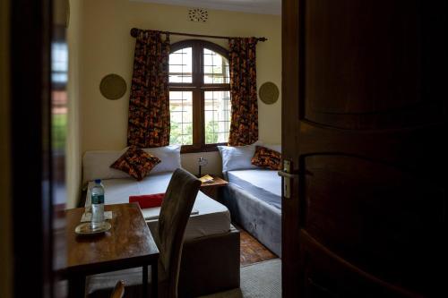 a living room with a couch and a table at Hansat Homestay Residence in Arusha