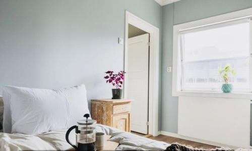 a bedroom with a bed and a window and a table at Apartment Aker brygge- Oslo sentrum in Oslo