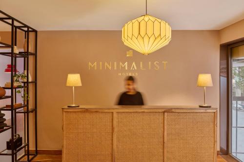a man sitting at the counter of azinski at Minimalist - The Varanasi Edit in Varanasi