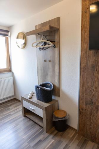 a bathroom with a trash can and a mirror at Chaplin in Kempten