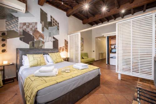 a bedroom with a bed with towels on it at Vittoria Residence Spanish Steps in Rome
