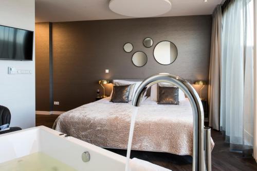 Ein Bett oder Betten in einem Zimmer der Unterkunft De Pier Suites