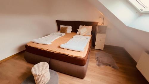 a bedroom with a bed in a attic at BM Wohnung in Dillingen an der Saar