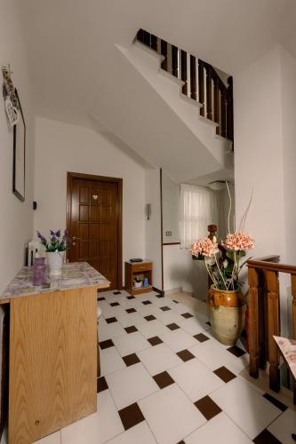 a living room with a checkered floor and stairs at Pollutrendy in Pollutri
