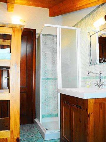 a bathroom with a shower and a sink and a tub at Gelsomino home in Furore