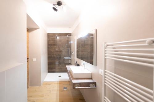 a bathroom with a sink and a mirror at Tenuta Marella in Santa Maria di Galeria