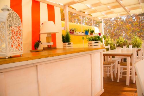 a kitchen with a counter and a table and chairs at Casa Martini in Rome