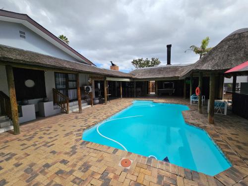 a swimming pool in the courtyard of a house at Balmoral Lodge in Bellville