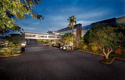 a building with a walkway in front of it at FM7 Resort Hotel - Jakarta Airport in Tangerang