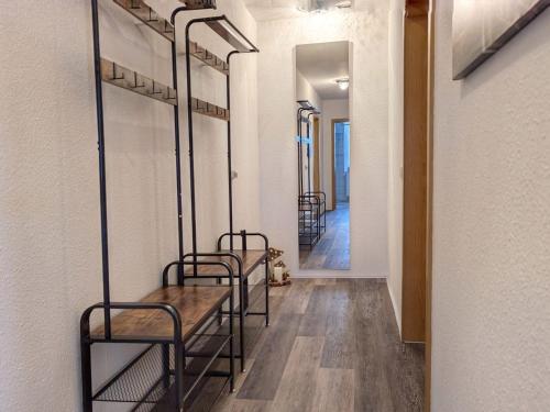 a row of mirrors in a room with a table at Ferienwohnung Barbarossa - Benno in Rottleben