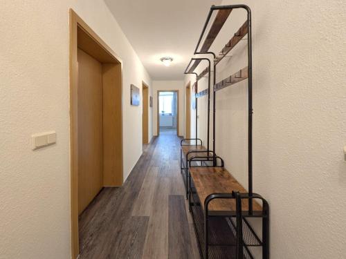a row of benches in a hallway of a building at Ferienwohnung Barbarossa - Benno in Rottleben
