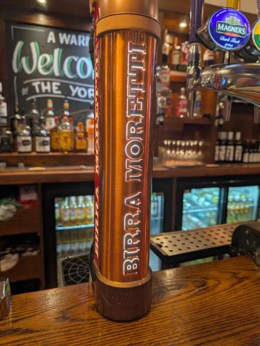 a brown beer bottle sitting on top of a table at THE YoRK in Morecambe
