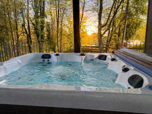 a jacuzzi tub in a yard with trees at KVillas in Severin na Kupi