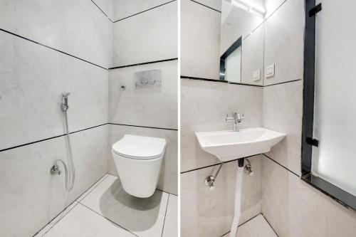 a bathroom with a toilet and a sink at Collection O MP Nagar in Bhopal