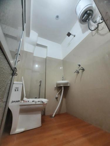 a bathroom with a sink and a toilet at Hotel Aditya Bikaner in Deshnoke