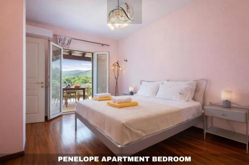 a bedroom with a bed and a balcony with a table at Epavlis Nadine Corfu in Corfu