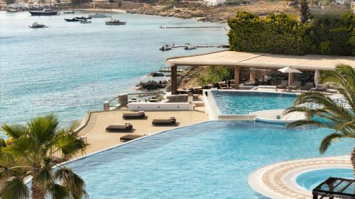 an infinity pool with a view of the ocean at Saint John Hotel Villas & Spa in Agios Ioannis Mykonos