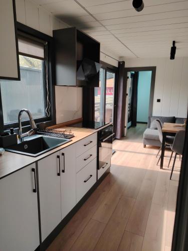 a kitchen with a sink and a counter top at Haller Camping in Budapest