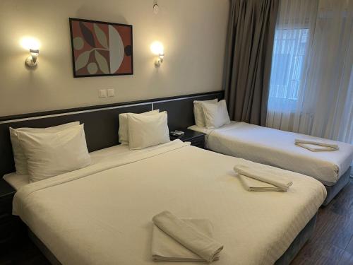 En eller flere senge i et værelse på Hotel Balca