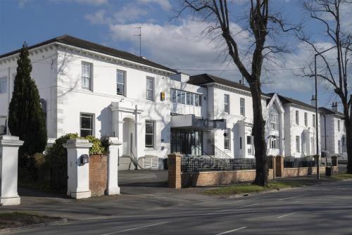 a row of white houses on a street at The Jephson Hotel; BW Signature Collection in Leamington Spa