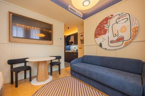 a living room with a couch and a table at CP Apartments San Mamés in Bilbao