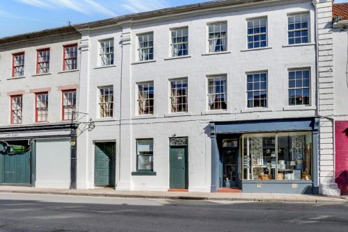 a white building on the corner of a street at The Drawing Room at The Merchants in Berwick-Upon-Tweed