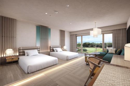 a hotel room with two beds and a living room at ANA InterContinental Ishigaki Resort by IHG in Ishigaki Island