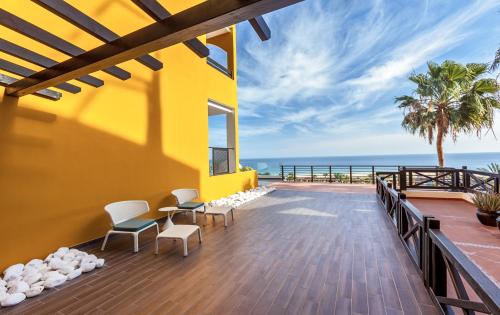 a balcony with a view of the ocean at Occidental Jandía Royal Level - Adults Only in Morro del Jable