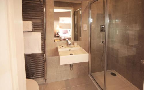 a bathroom with a sink and a shower at Jog Lodge 5 By Together Travel - 3 Bed in John O Groats