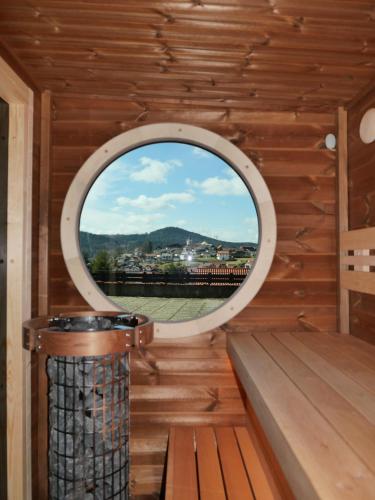 a window in a sauna with a view at Landhaus Meine Auszeit in Bodenmais
