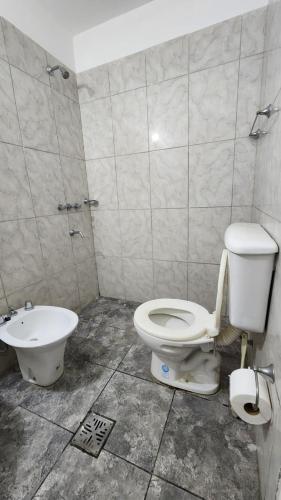 a bathroom with a toilet and a sink at Norte Hogar in Salta