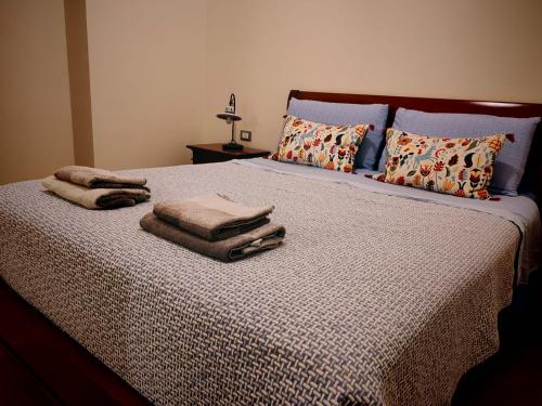 a bed with pillows and towels on top of it at Lissy Casa Vacanze in Lamezia Terme