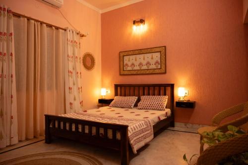a bedroom with a bed with two pillows on it at Inayat-Pet friendly boutique homestay in Dehradun