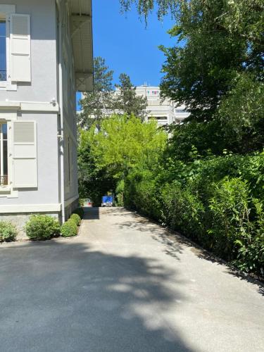 a driveway in front of a white building at Residence Mont-Blanc in Geneva