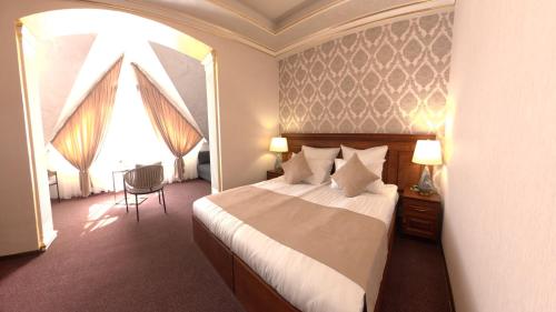 a hotel room with a bed and a window at Passage Hotel Restaurant in Goris