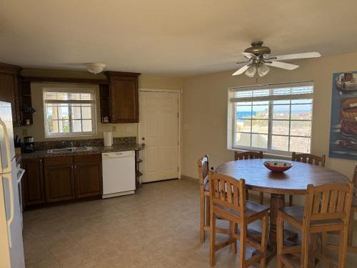 a kitchen with a wooden table and a dining room at Casa Stu Playa de Oro Rental in San Felipe