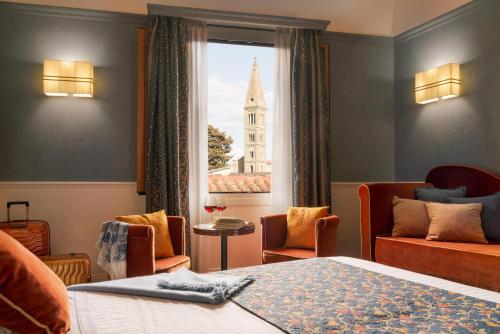 a hotel room with a bed and a window at Rivoli Boutique Hotel in Florence