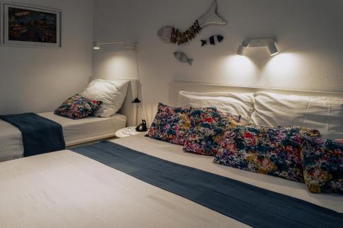 a room with a bed with pillows on it at Cyklo Apartmán Třeboň in Třeboň
