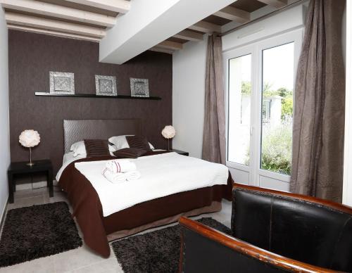 En eller flere senger på et rom på Nature & Chateaux