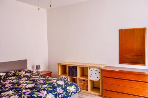 a bedroom with a bed and a dresser at Da Nonna Mena in Fossacesia