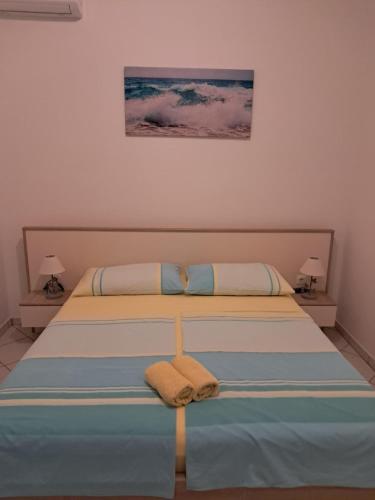a bedroom with a bed with a towel on it at Nadalina 10 in Starigrad