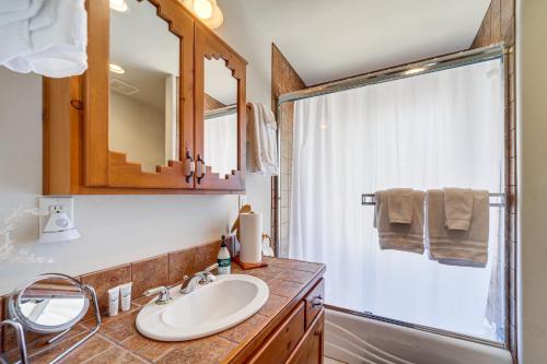 a bathroom with a sink and a shower at Golfer's Haven! Mtn-View Dewey Gem w/ Pool Access in Dewey