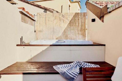 a bathroom with a sink on top of a building at Conca9, Luxury attic with jacuzzi in Navigli in Milan