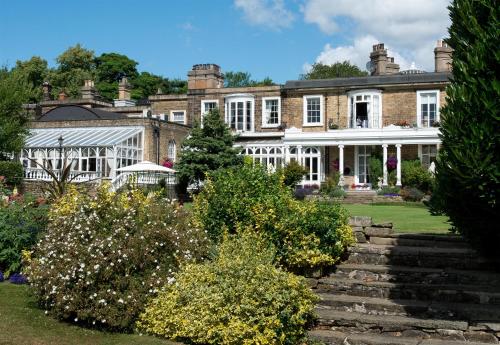 a large house with a garden in front of it at Ringwood Hall Hotel & Spa, Best Western Signature Collection in Chesterfield