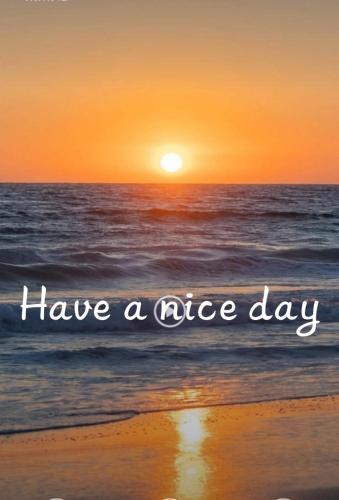 a sunset on the beach with the words have a nice day at PKM hostel in Cha Am