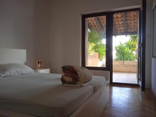 a bedroom with a bed and a sliding glass door at Apartment Sofia in Kožino