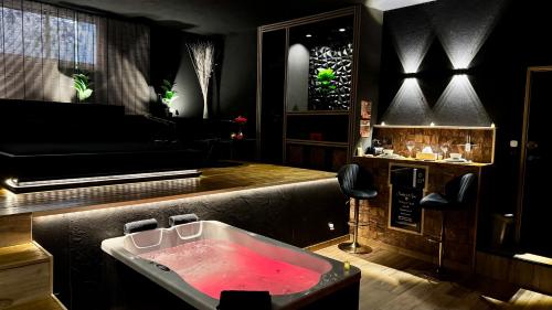 a bathroom with a bath tub with a piano at MIRAGE47SPA - Private Spa Suite with Jacuzzi & Sauna in Marbella in Marbella